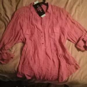 Petite. Quarter length button cuff sleeves.